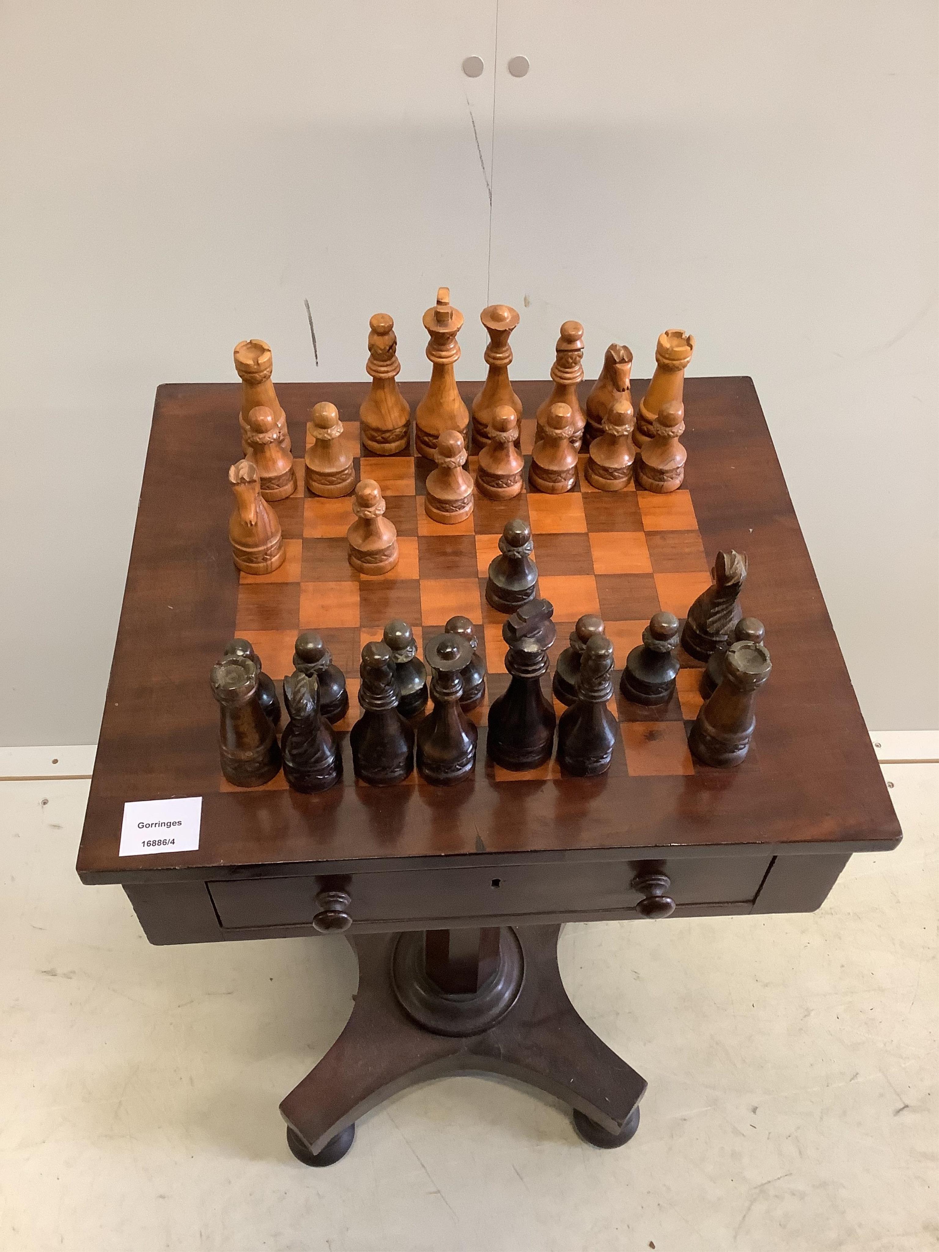 A Victorian mahogany games table, width 44cm, depth 38cm, height 74cm, together with a later turned wood chess set. Condition - fair to good